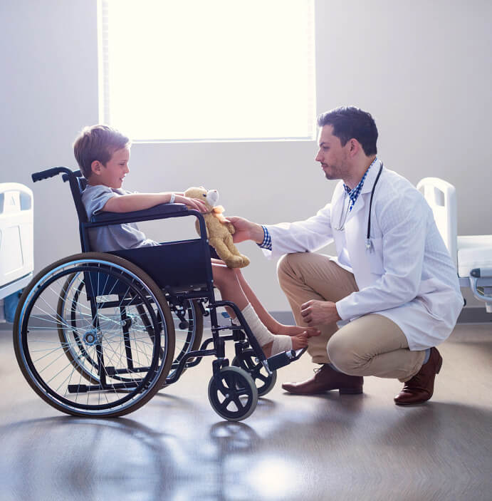 kid in a wheelchair and doctor talking